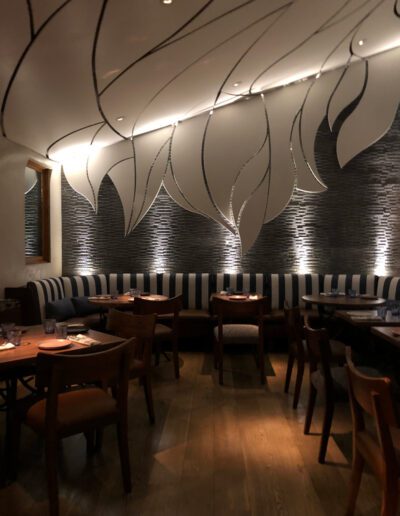 The interior of a restaurant with wooden tables and chairs.