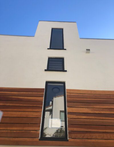 A house with wooden siding and a window.