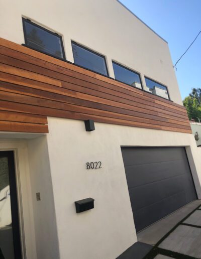 A modern house with a garage and a garage door.