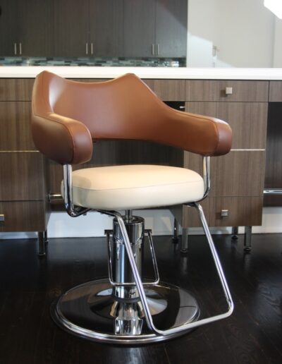 A salon chair in a kitchen.