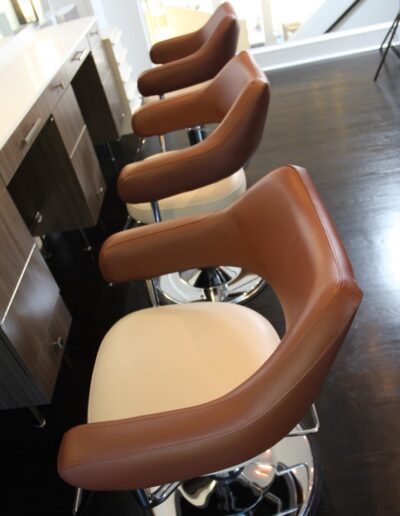 A row of chairs in a salon.