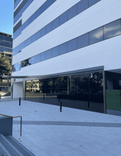 An image of an office building with glass windows.