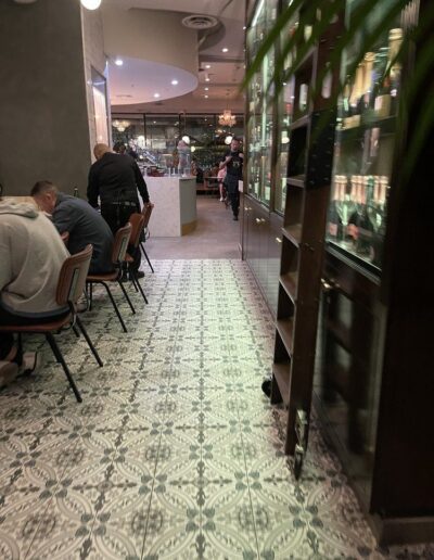 A group of people sitting at a table in a restaurant.