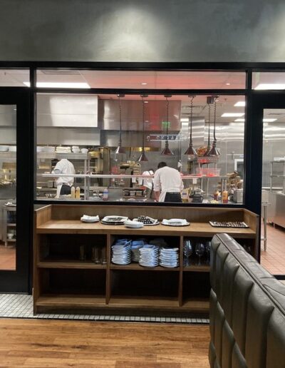 A large kitchen with a large glass door.