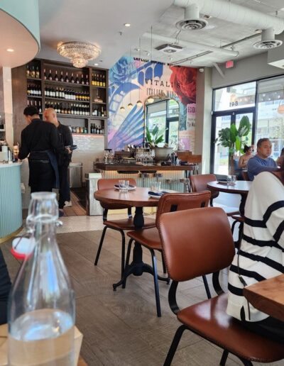 A group of people sitting at tables in a restaurant.